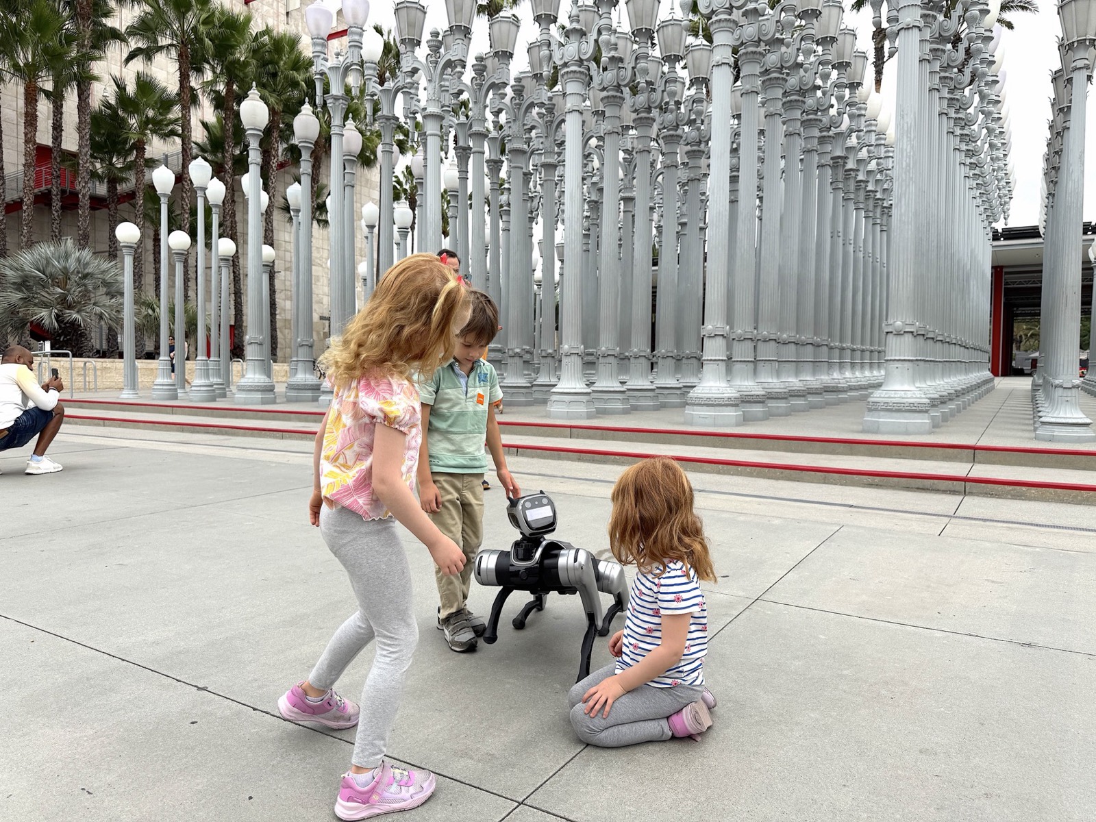 RoboDog robot dog surrounded by guests at LACMA in Los Angeles